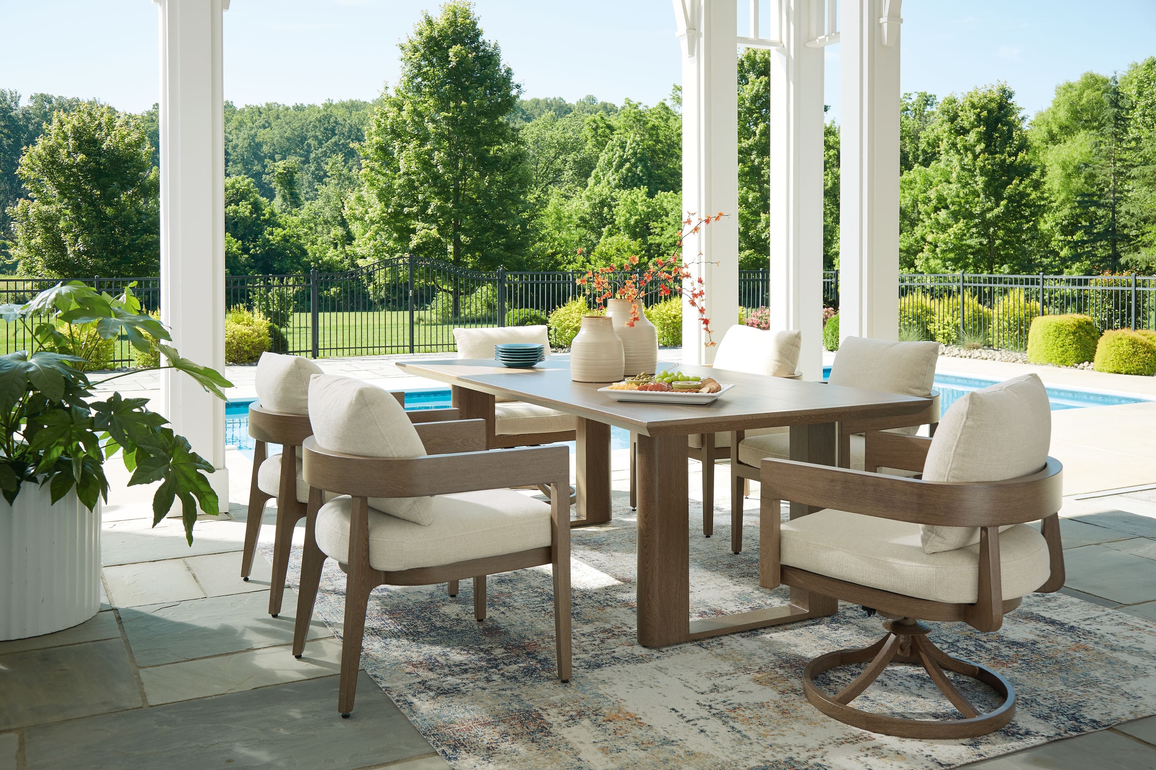 Serene Bay - 7 Pc. - Dining Table, 4 Arm Chairs, 2 Swivel Chairs - Dark Brown
